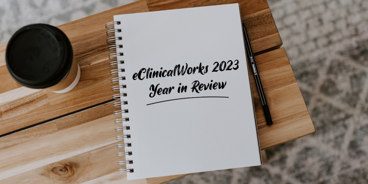 a notebook with the words eClinicalWorks 2023 Year in Review