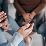 hand shown in a therapy session representing Behavioral Health Counselors