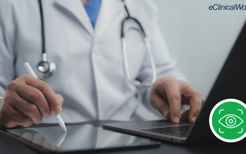 Doctor working at laptop and ipad, icon of Image AI fax from eClinicalWorks on screen.